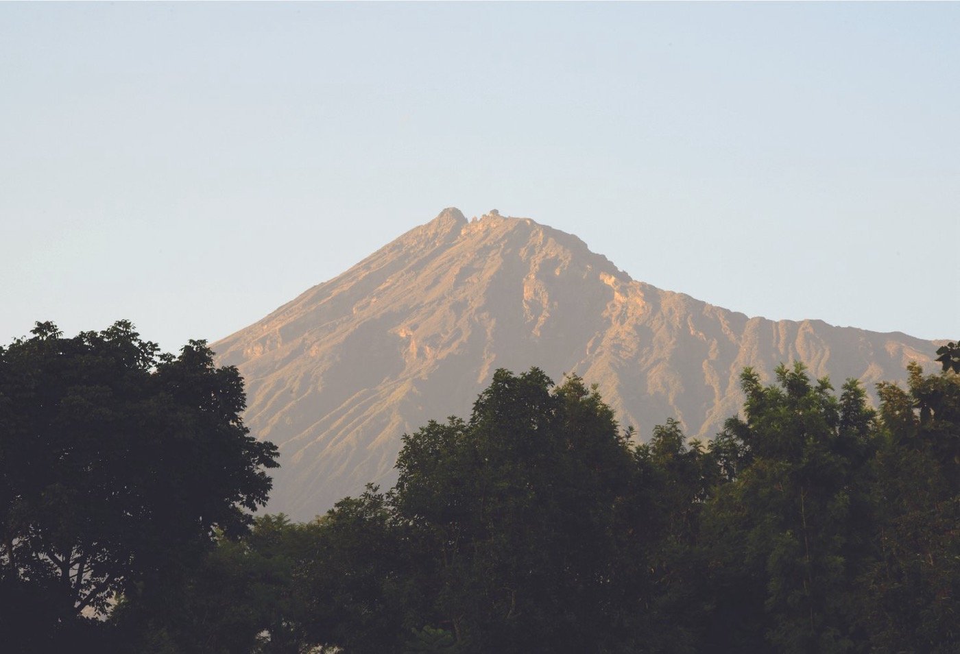 The summit ridge of Mount Meru above the clouds